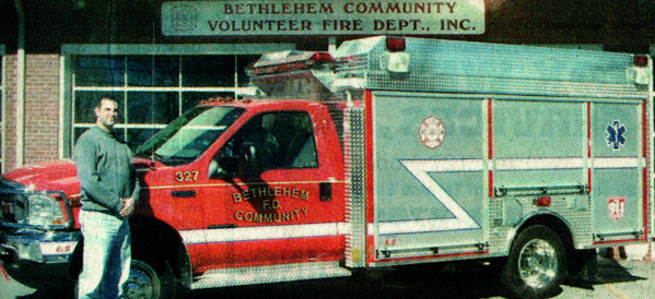 Bethlehem Community Volunteer Fire Department Chief Shanon Lowrance stands beside a new Anchor-Richey firetruck.